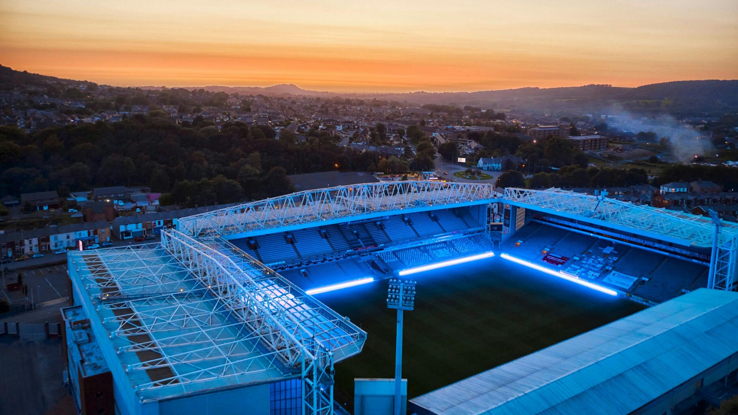 Aerial shot of football stadium with bright perimeter LED panels